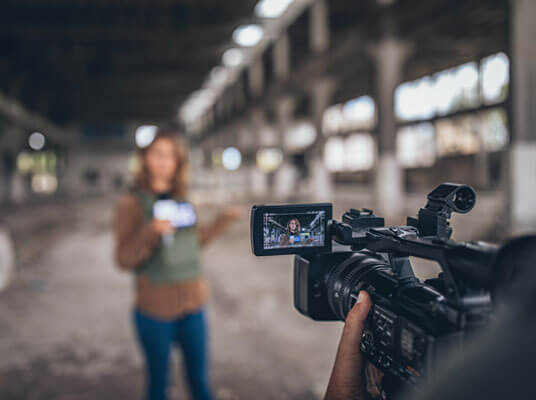 Cameraman With camera shooting 